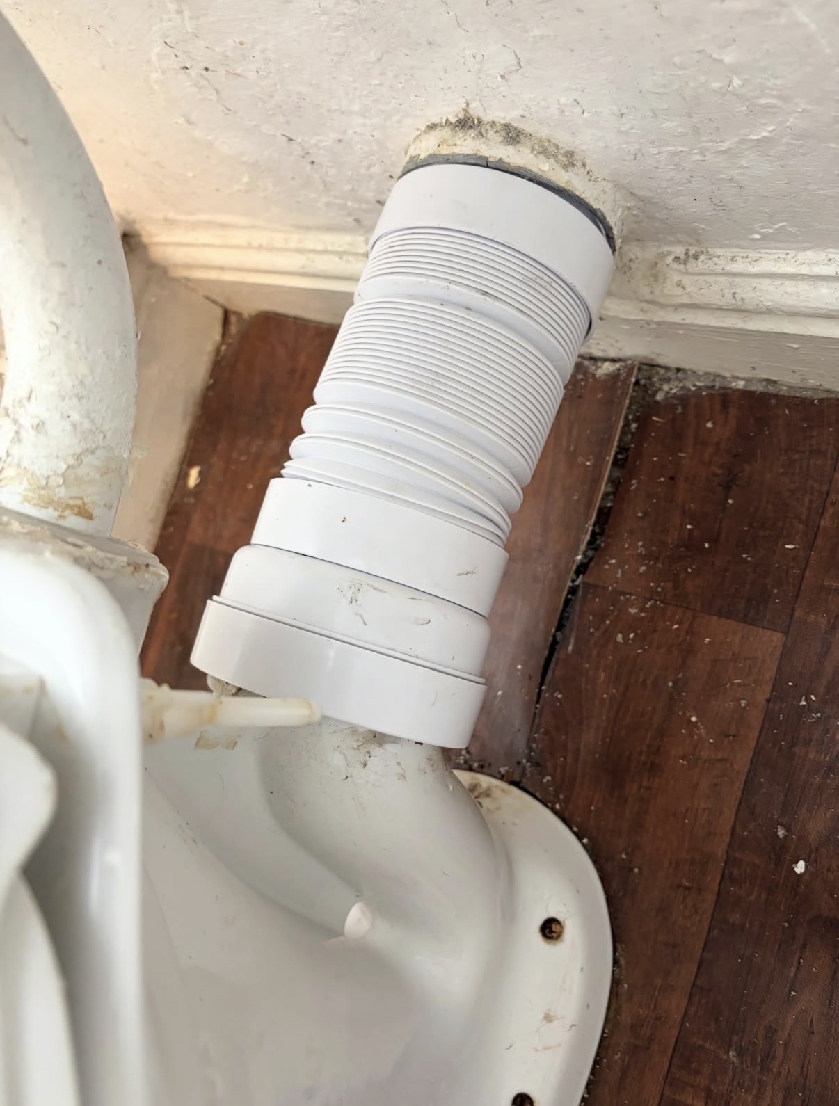 Toilet waste pipe fitting by Parallel Property Services