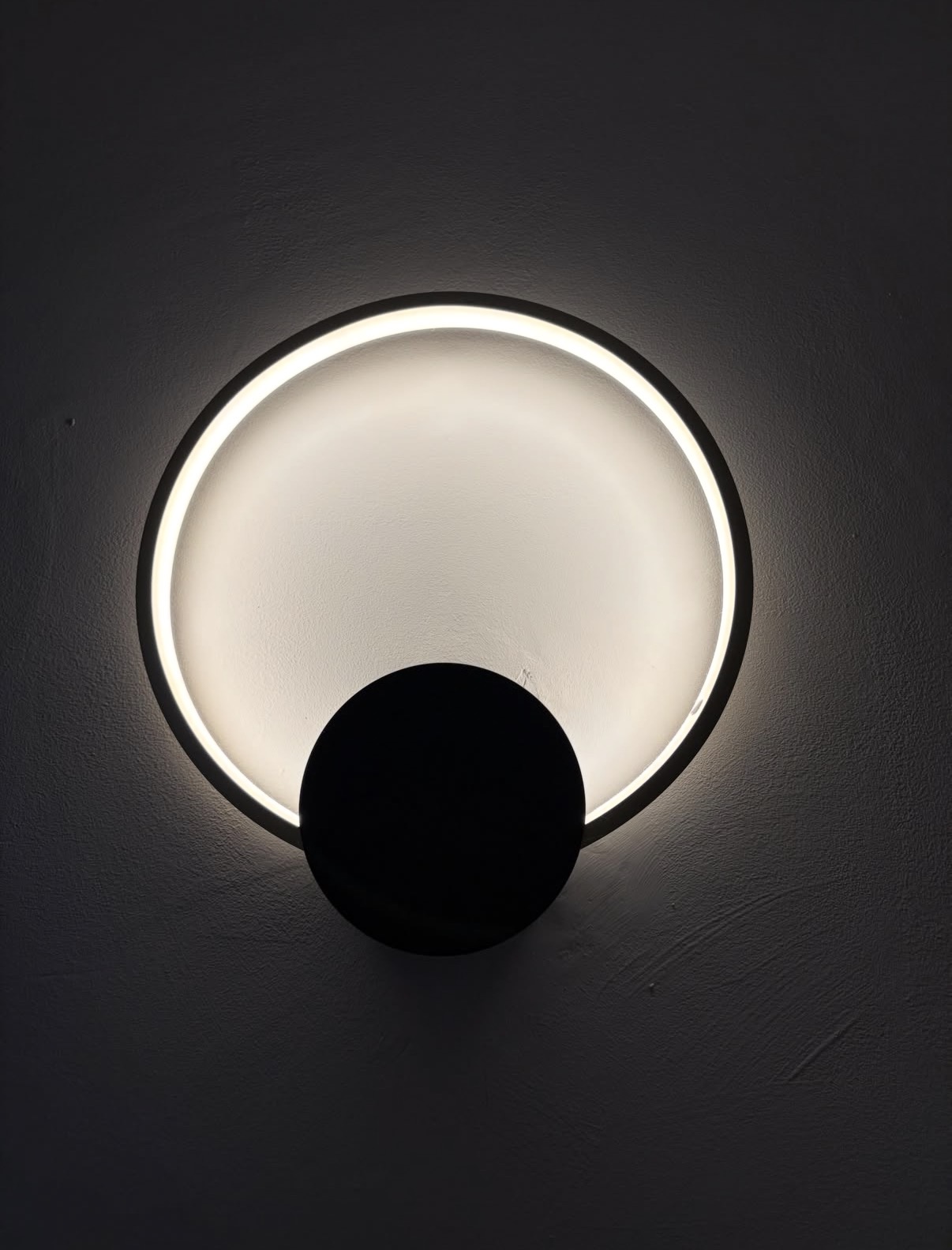 Modern wall light – illuminated by Parallel Property Services