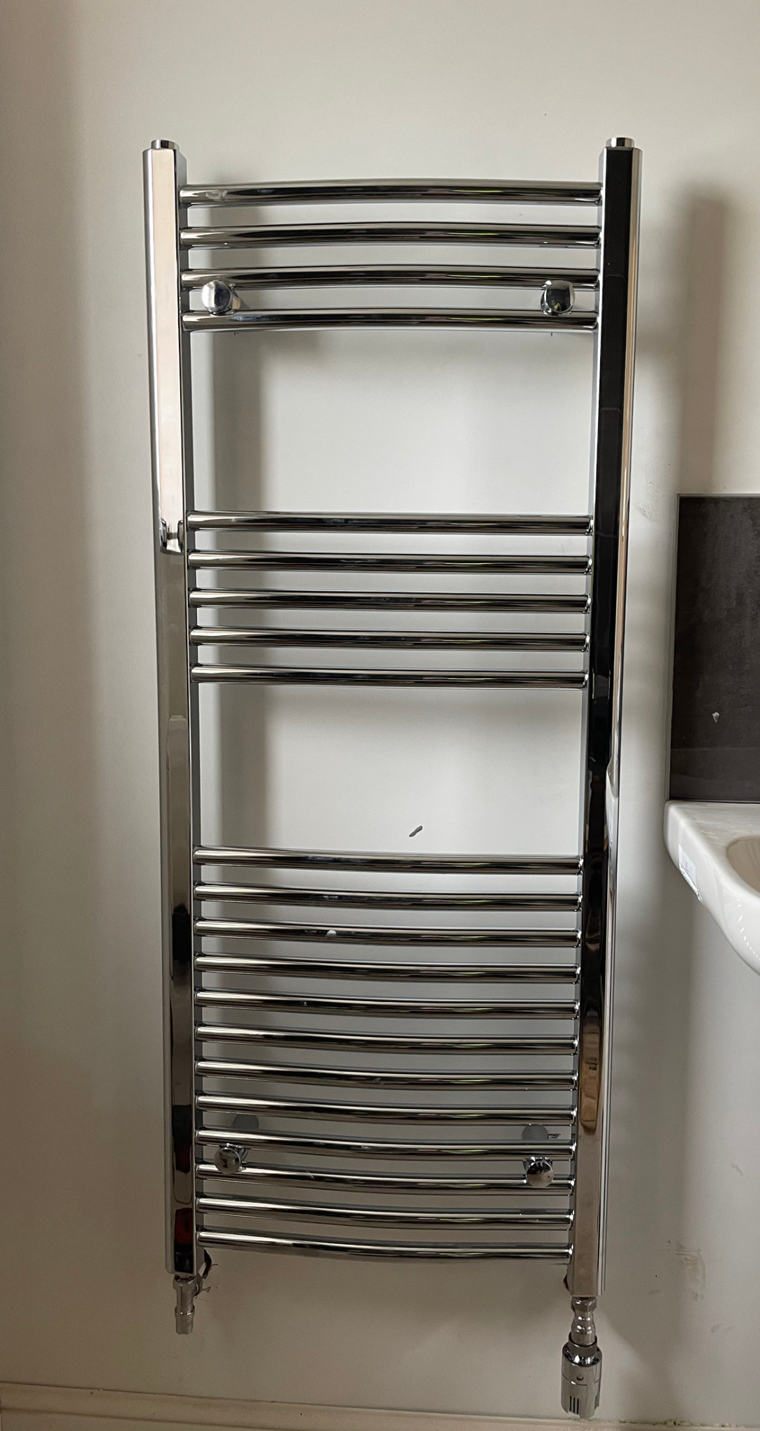 Chrome heated towel radiator installation by Parallel Property Services