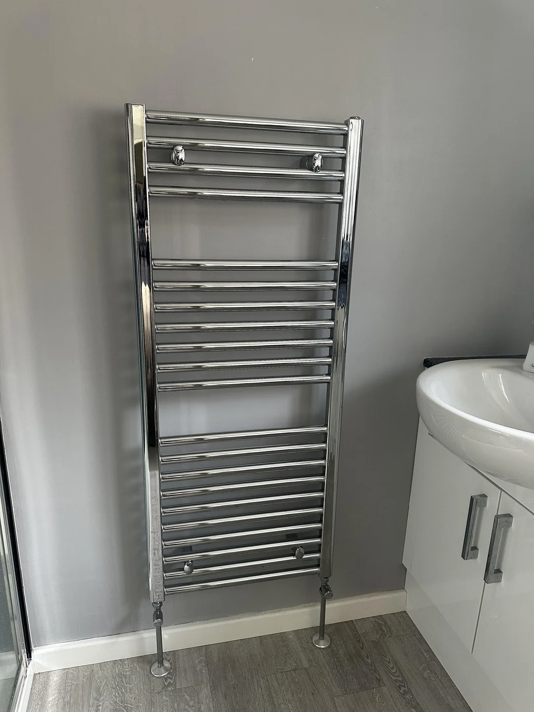 Chrome heated towel radiator installation by Parallel Property Services