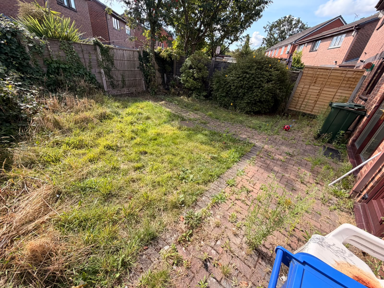 Back garden before clearance by Parallel Property Services