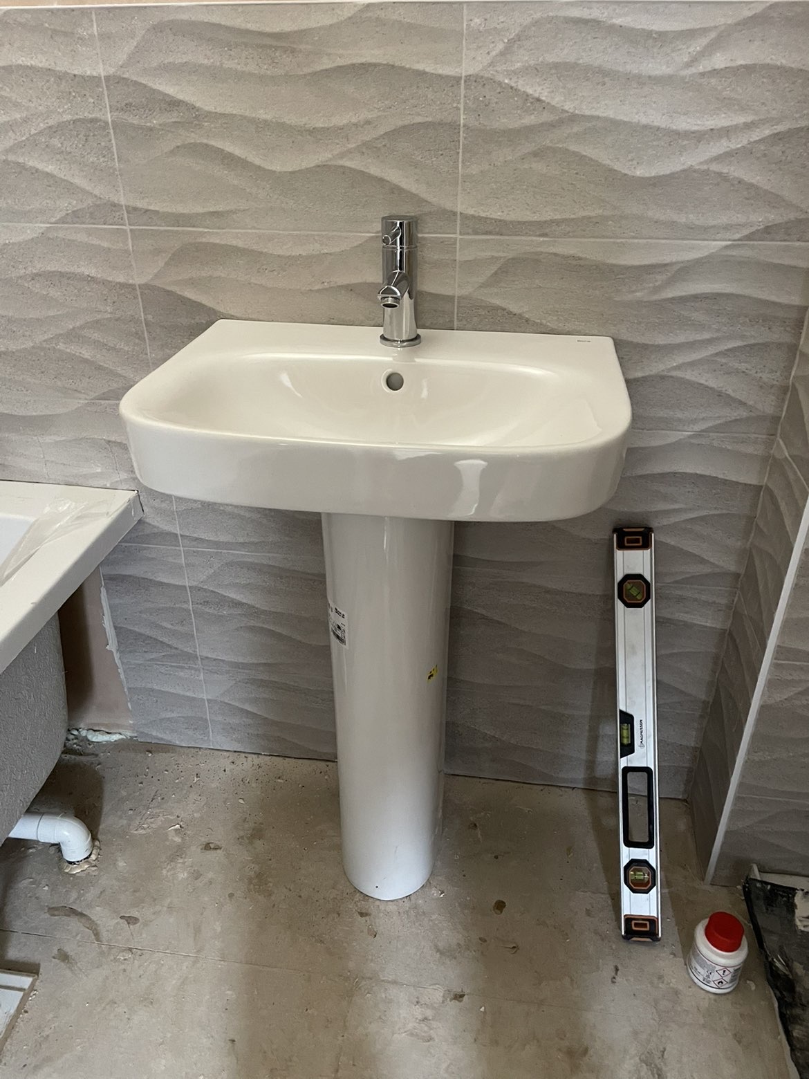 Wall mounted basin installation by Parallel Property Services